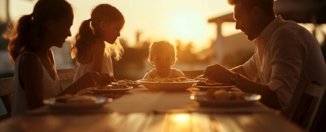 Family dinner outdoors at sunset 1000